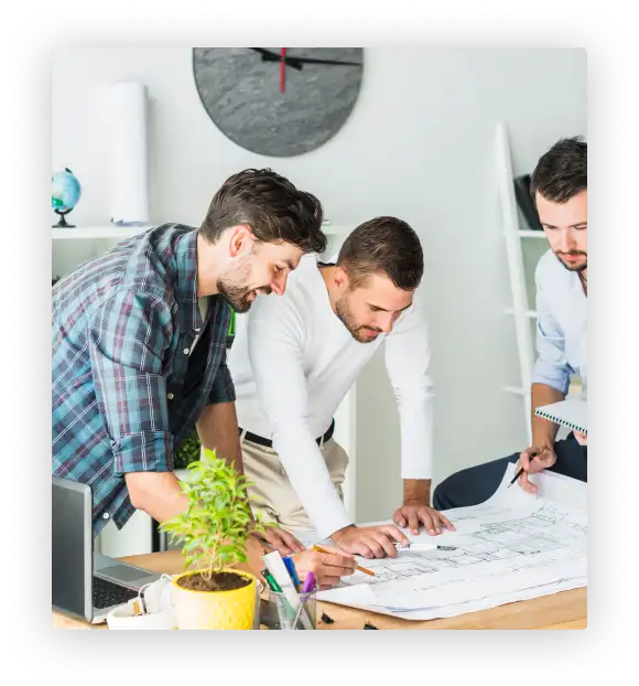 Architects working on blueprints